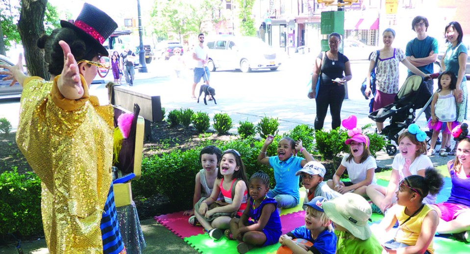 NYC magician Razzle Dazzle entertains kids at Atlantic Antic Festival, Brooklyn
